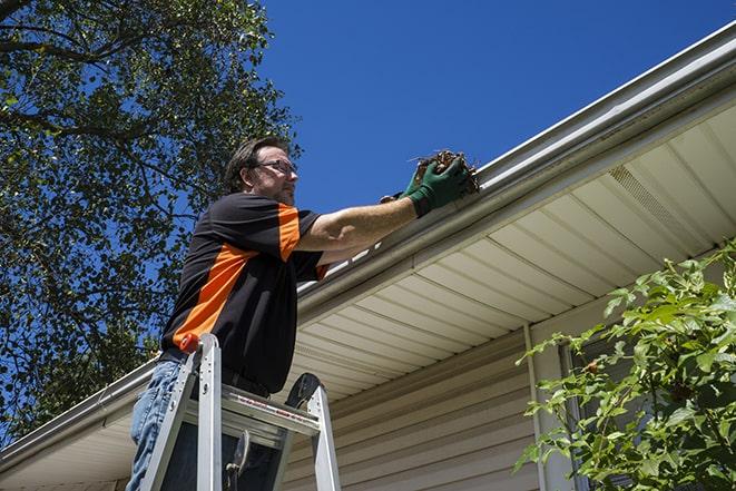 sealing leaks and cracks in the gutter system in Foley